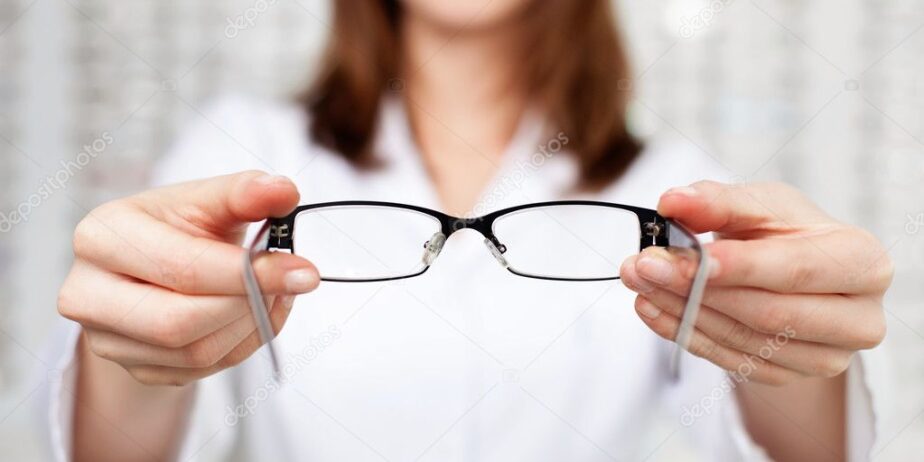 depositphotos_25792505-stock-photo-optometrist-optician-giving-glasses-to
